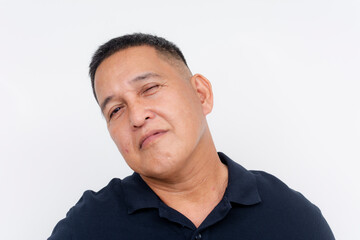 A portrait of a middle-aged Asian man showing skepticism, isolated on a white background, with a doubtful look, seeing through someone's bluff.