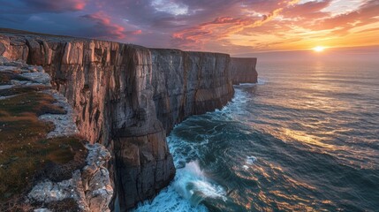 Coastal cliffs with crashing waves below and a dramatic sunset, nature landscape