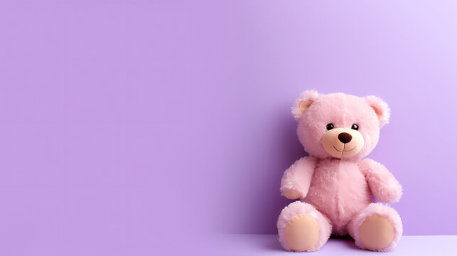 Toy teddy bear sitting on bokeh background