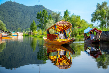 Dal Lake and the beautiful mountain range in the background in the summer Boat Trip of city...