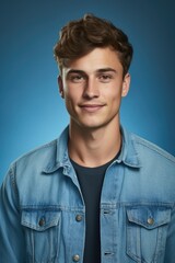 Obraz premium A man in a denim jacket posing for a picture. Suitable for fashion or casual lifestyle themes