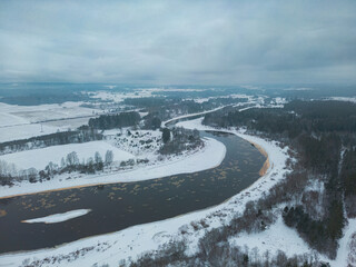Aerial view on the river in the countryside in the winter time