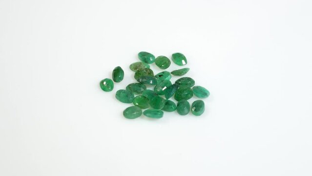 natural green emerald beryl on the white background