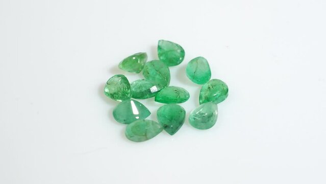 natural green emerald beryl on the white background