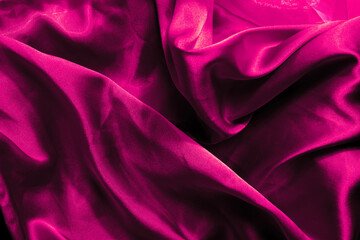 Beautiful pink silk background. Draped background of fabric, texture. Valentine's Day concept....
