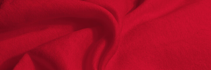 Bright, red, soft, fluffy, light blanket. Texture cotton textile background. Banner