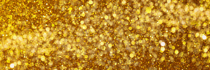 Abstract golden trendy backdrop. Sparkling background made of lights. Festive blurred banner