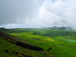 Low clouds over the green fields of Serra do Cume