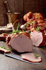 Smoked ham on an old wooden table.