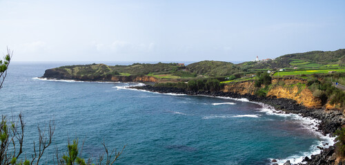 Fototapeta premium Looking south to Baia das Minas and Farol das Contendas, Terceira Island