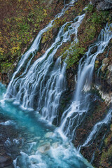 日本　北海道上川郡美瑛町白金にあるブルーリバー橋から見える白ひげの滝と紅葉