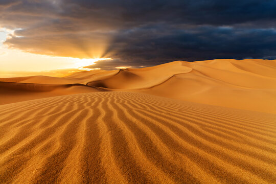 Sunset over the sand dunes in the desert. Rub' al Khali desert
