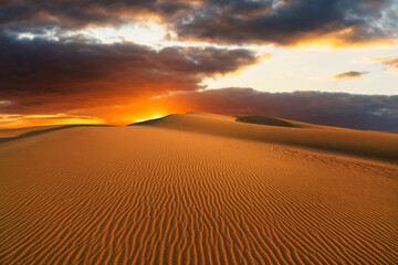 Sunset over the sand dunes in the desert. Rub' al Khali desert