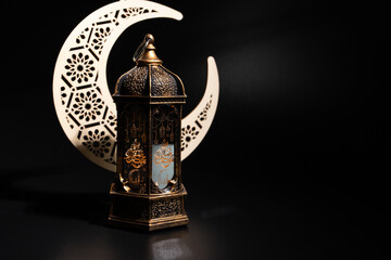 Ramadan Kareem moon and lantern on black background, Arabic celebration, vintage lamp