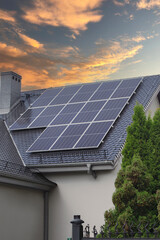 Solar panels installed on the roof of a residential building, capturing energy during a vibrant...