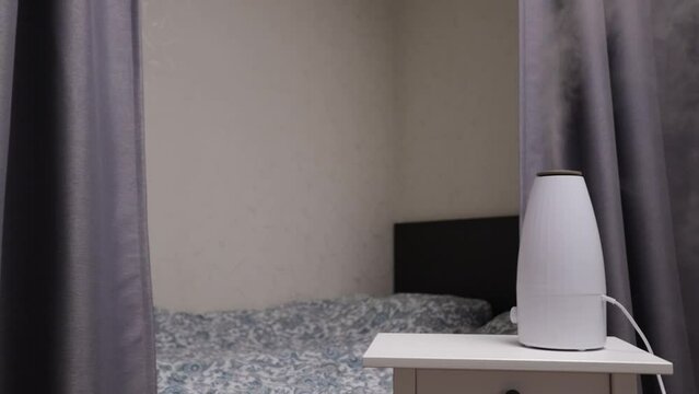 air humidifier in the bedroom, ultrasonic diffuser on the table,Modern home interior,