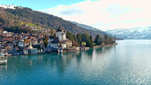 Aerial view of Oberhofen Castle panoramic view at Lake Thunersee in Swiss Alps, Switzerland. Beautiful landscape, Lake Thun is an Alpine lake in Switzerland&rsquo;s Bernese Oberland region in Bern Canton 4K