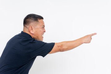 An enraged Asian man aggressively pointing and yelling, with strong heated emotion, isolated on a...