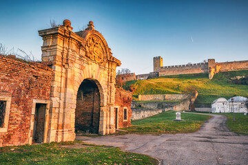 The old walls and ruins of Belgrade's Kalemegdan fortress gates serve as a popular tourist destination for Serbian and international visitors alike. - obrazy, fototapety, plakaty
