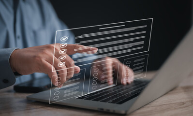Businessman on laptop managing documents and tasks via a DMS. Highlights digital checklists,...