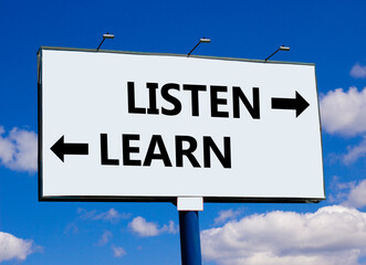 Listen and learn symbol. Concept word Listen and Learn on beautiful billboard with two arrows. Beautiful blue sky with clouds background. Business and listen and learn concept. Copy space.