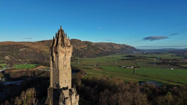 Drone footage of the tower of National Wallace Monument in Stirling, Scotland, UK