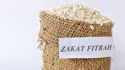 Rice grains in a burlap sack for zakat, the Islamic concept of zakat in the holy month of Ramadan