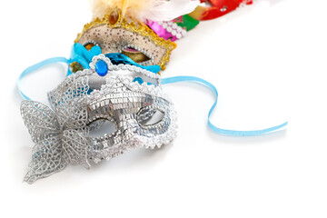 Multicolored masks for celebration carnival. Jewish Purim or Mardi Gras. Space for text