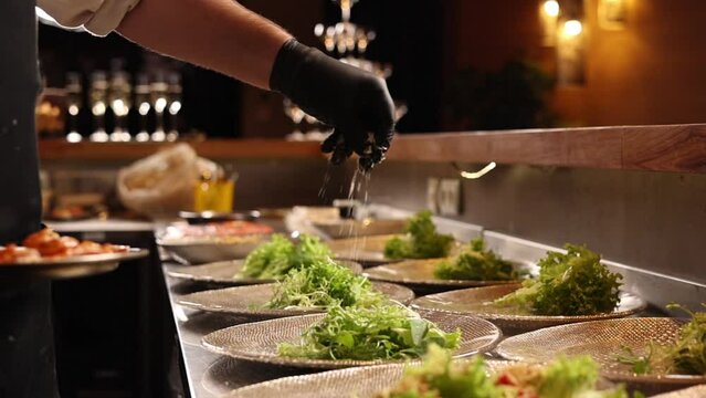 Chef prepares seafood dishes in a Japanese restaurant