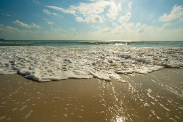 Sea beach wave splash on sand beach sunrise relax summer vacation