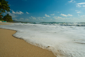 Sea beach wave splash on sand beach sunrise relax summer vacation
