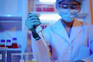 Asian female scientist passionately conducts experiments in a laboratory, surrounded by petri...