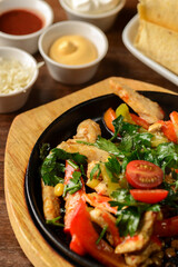 fajitas on a cast-iron plate