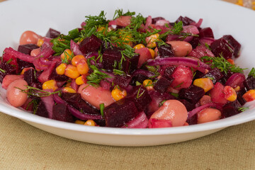 Beetroot salad on dish, side view of fragment close-up