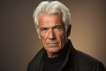 Portrait of a senior man with grey hair. Studio shot.