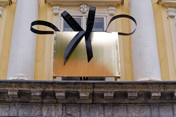 Sightseeing at City of Ljubljana with close-up of golden wrapping with black ribbon on a cloudy...
