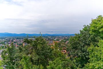 Aerial view of City of Ljubljana seen from Sance castle hill with mountain panorama in the...