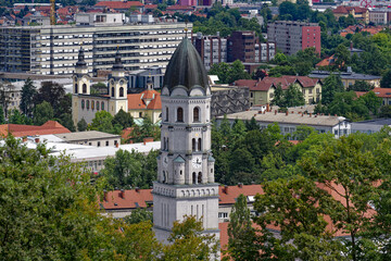 Aerial view of Slovenian City of Ljubljana with church tower seen from viewpoint of castle hill on...