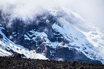 Majestic Snow-Capped Peak of Mt. Kilimanjaro Amidst the Clouds