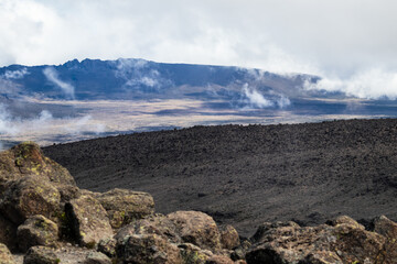 Mystic Landscape: Volcanic Terrain Under a Cloudy Sky