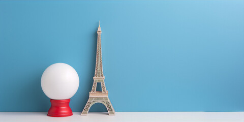 3D rendering of a miniature Eiffel Tower and a crystal ball on a blue background.