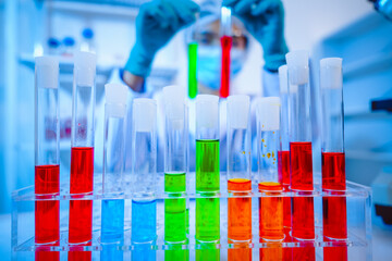 Female scientist diligently conducts virus blood lab tests, contributing to critical research and advancements in the field of virology.