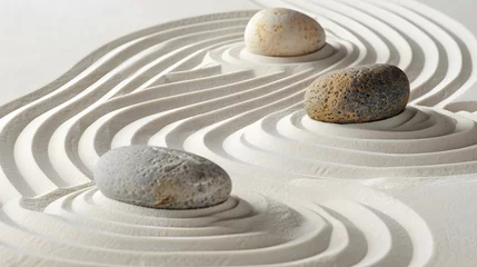  Zen stones with lines on the sand. Spa therapie and meditation concept © Ziyan