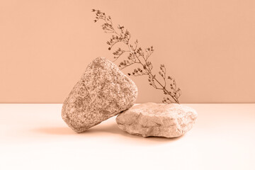 Stone Podium for promotion on beige Background. Natural rock pedestal. Two stone podiums. Beauty product mockup. Scene to show products. Showcase, display case. Front View, soft shadow.