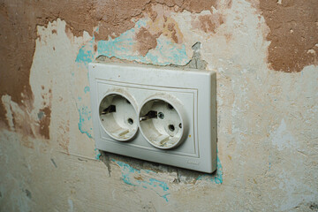 Socket on a concrete wall. Repair
