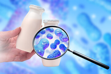 Bottles of yogurt with probiotics. Fermented milk products in hands. Bifidobacteria under...