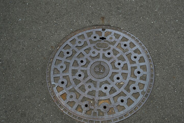 Japanese sewer manhole and asphalt