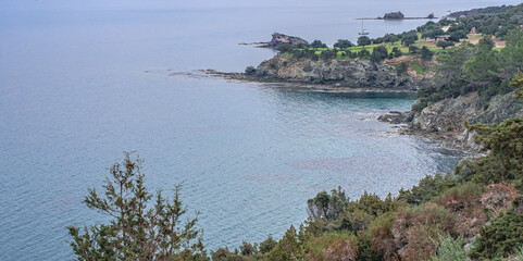 Obraz premium View of Chrysochou Bay coast as seen from Aphrodite Nature (Circular) Trail on Akamas Peninsula, above Neo Chorio and Latsi villages. Pafos district, Cyprus