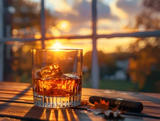 Foto op Aluminium A glass of whiskey with ice sits next to a smoking cigar.  © wing