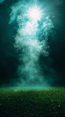 A mystical display of smoke or mist rising from grass against a dark, illuminated background